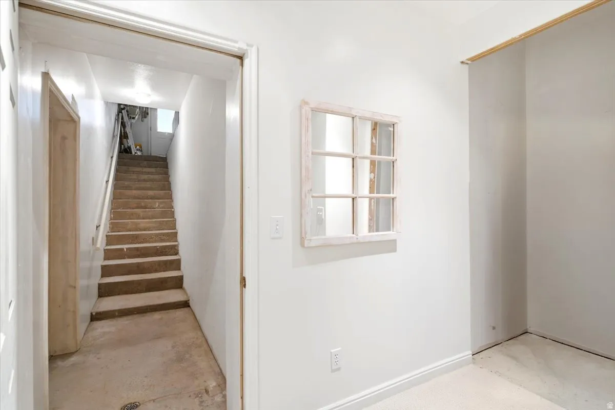 Stairs to garage from basement and on the right place for future elevator.