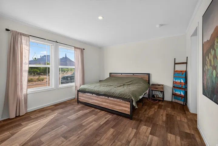 Room with wood-finish flooring and light-toned walls