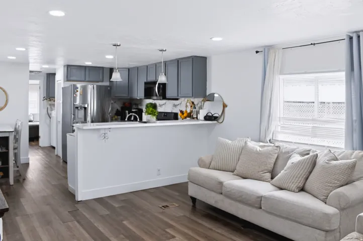 Open-concept living area with wood-finish flooring
