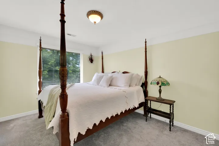 Light beige walls complemented by white crown molding and baseboards