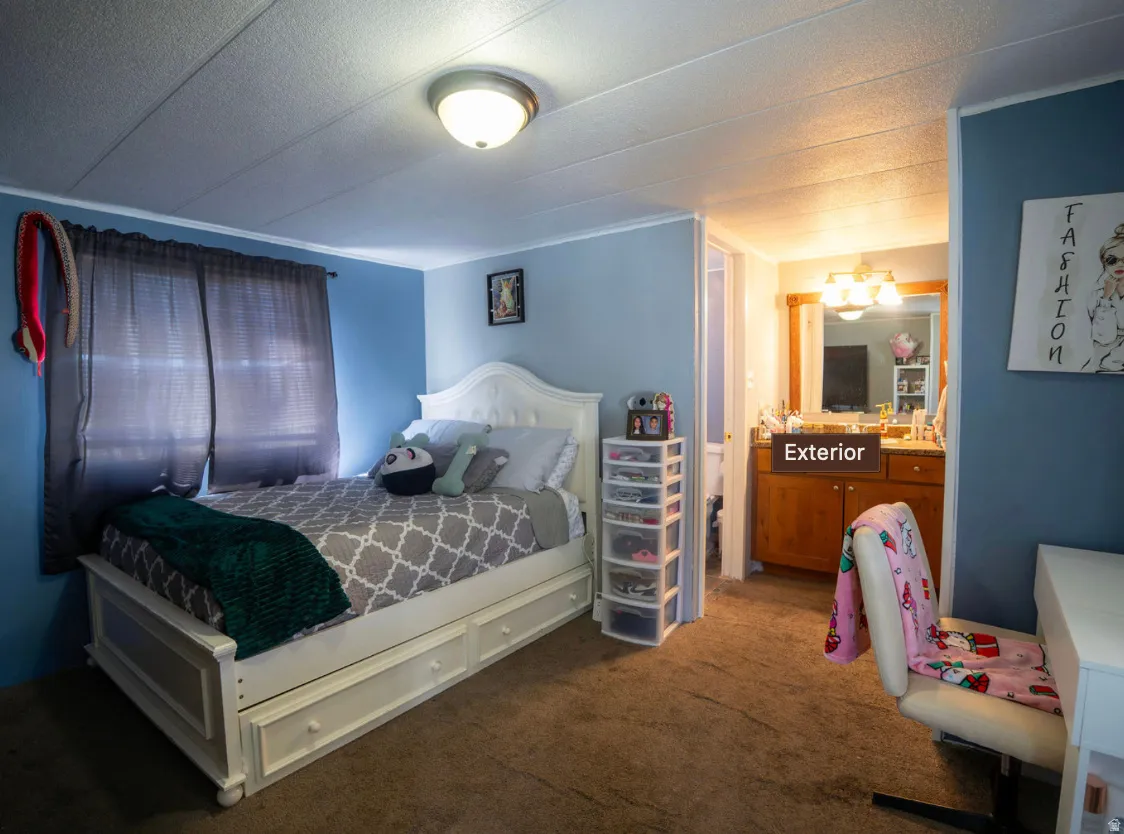 Carpeted bedroom with light blue walls and white trim