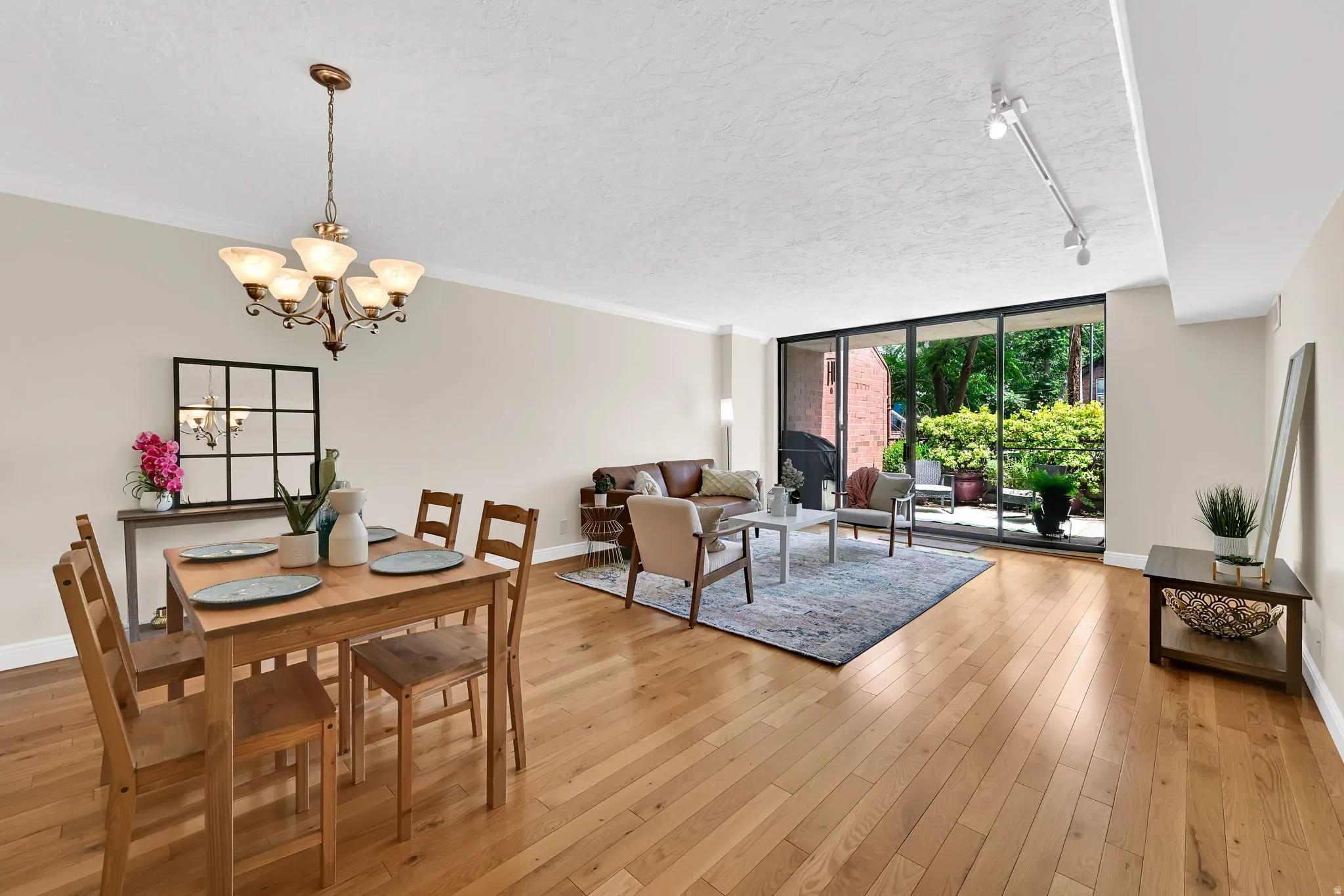 Open concept living area featuring wood-finish flooring