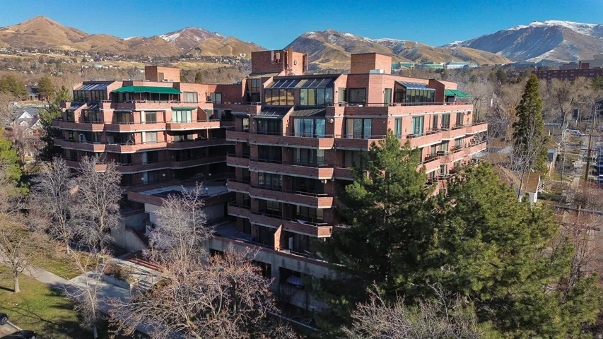 Terraced multi-story building featuring brick exterior construction