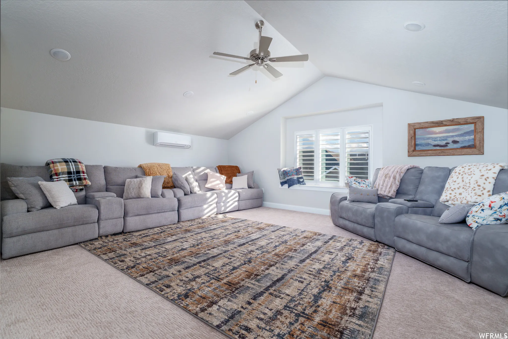 Spacious bonus room featuring vaulted ceilings, recessed lighting, a ceiling fan, a mini-split HVAC unit, and a window with plantation shutters