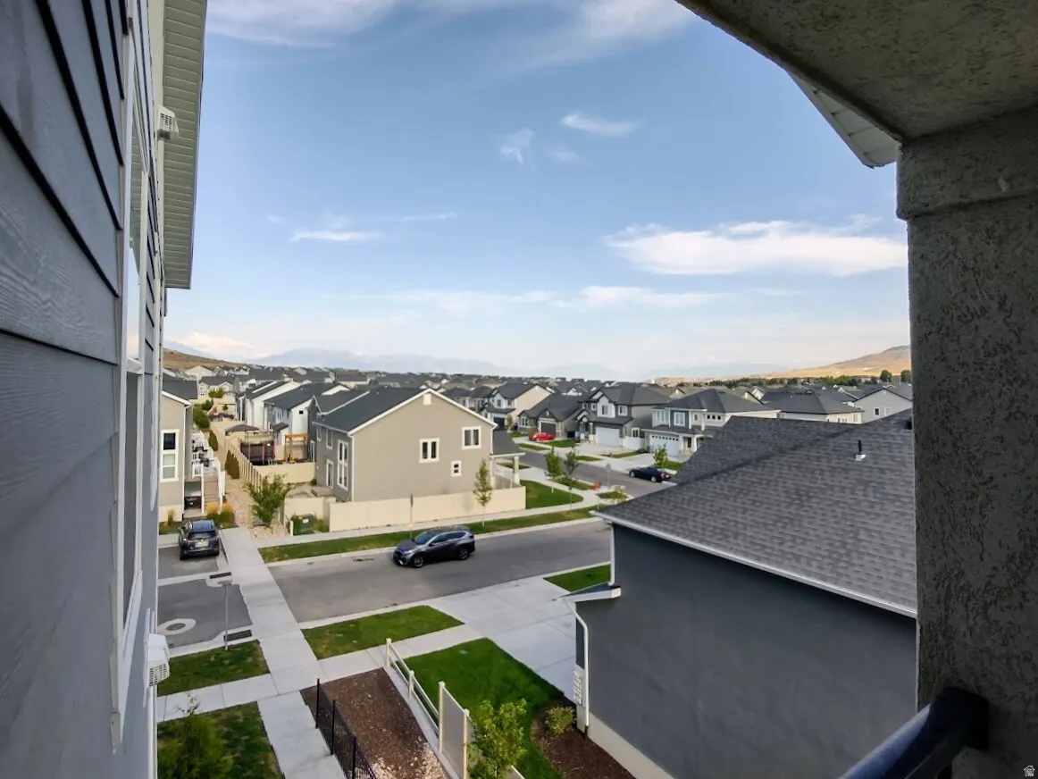 Expansive residential landscape with distant mountain ranges