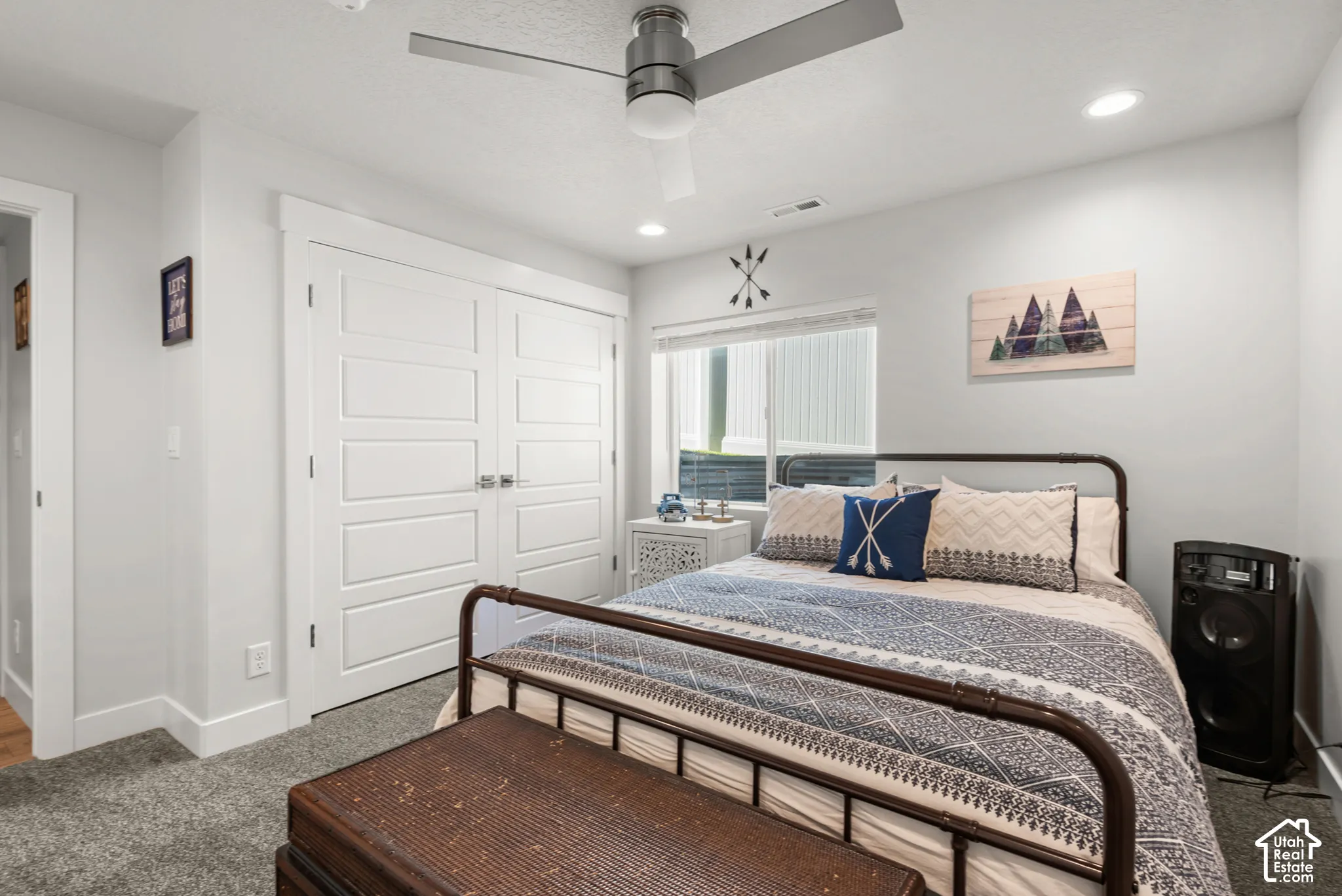 Bedroom featuring a ceiling fan, recessed lighting, and a window with blinds