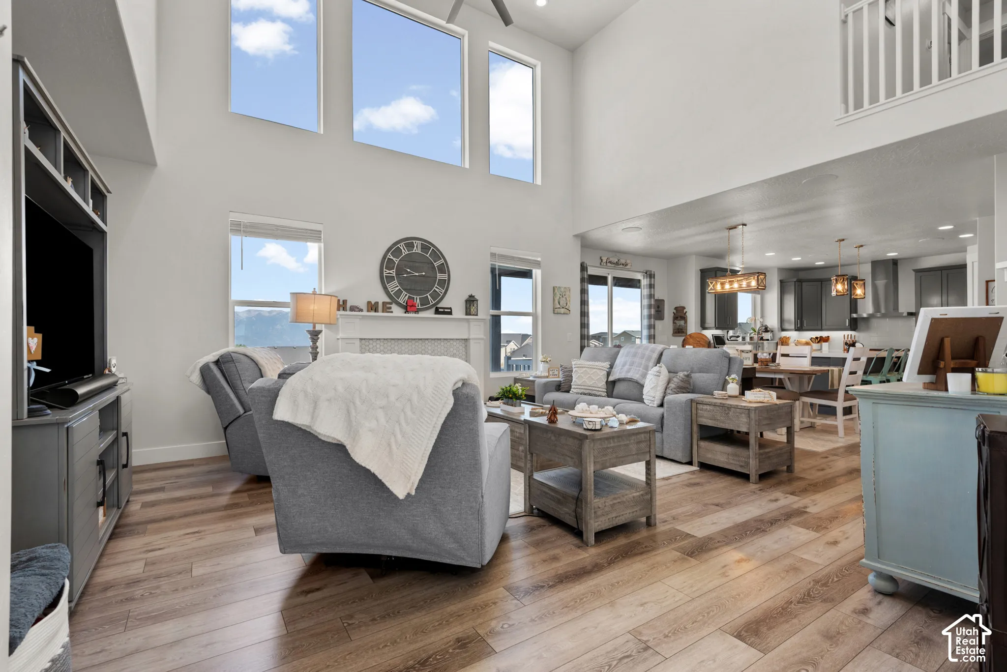 Expansive living area featuring soaring ceilings and high windows
