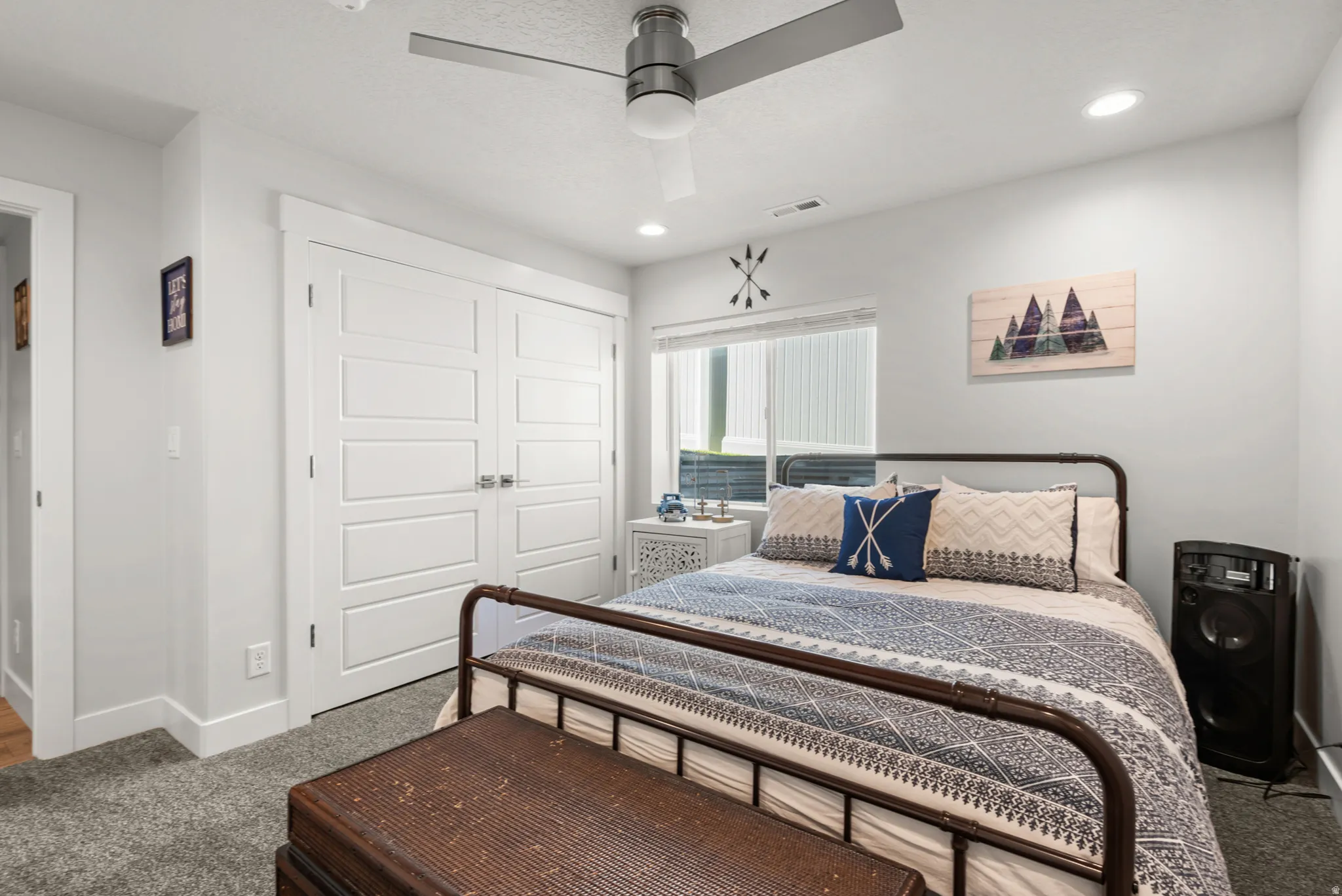 Bedroom featuring a ceiling fan, recessed lighting, and a window with blinds