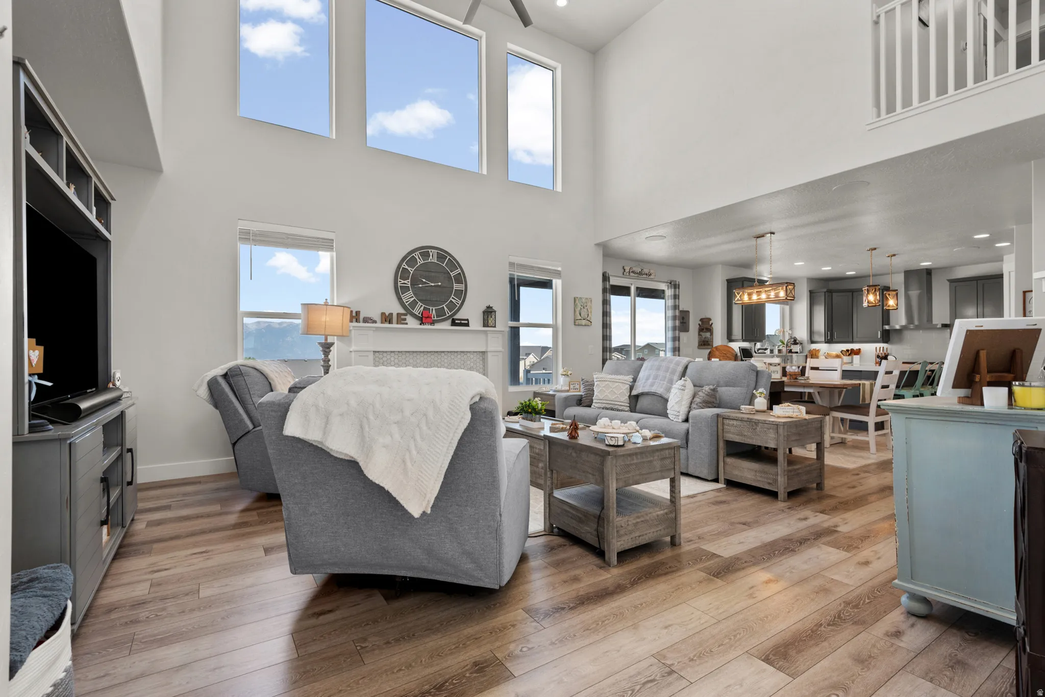 Expansive living area featuring soaring ceilings and high windows