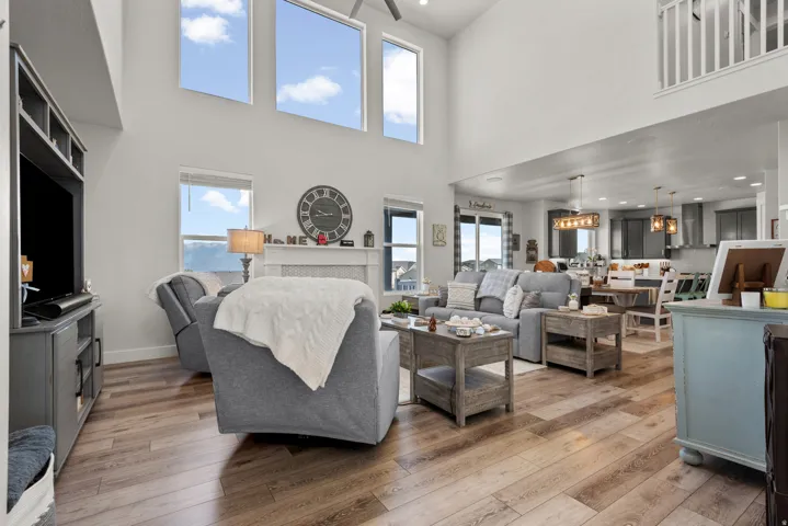 Expansive living area featuring soaring ceilings and high windows