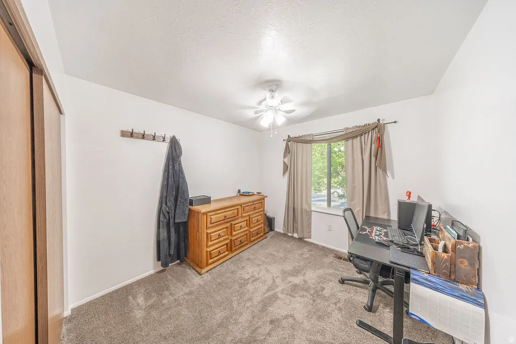 Interior space featuring neutral carpeting and white walls