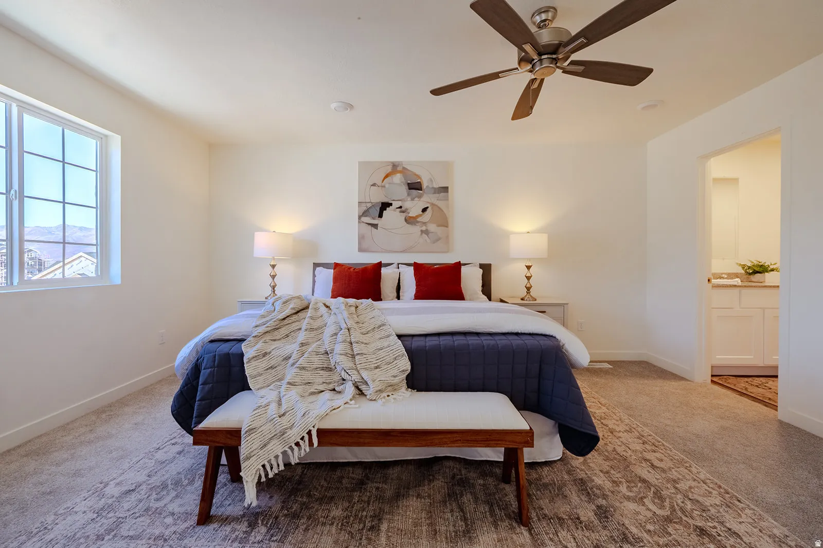 Carpeted bedroom featuring a large window, recessed lighting, and a ceiling fan