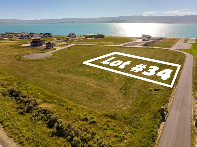 Expansive grassy lot with waterfront proximity