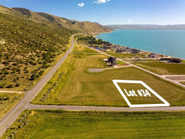 Grassed parcel marked as Lot #34, bordered by roadways