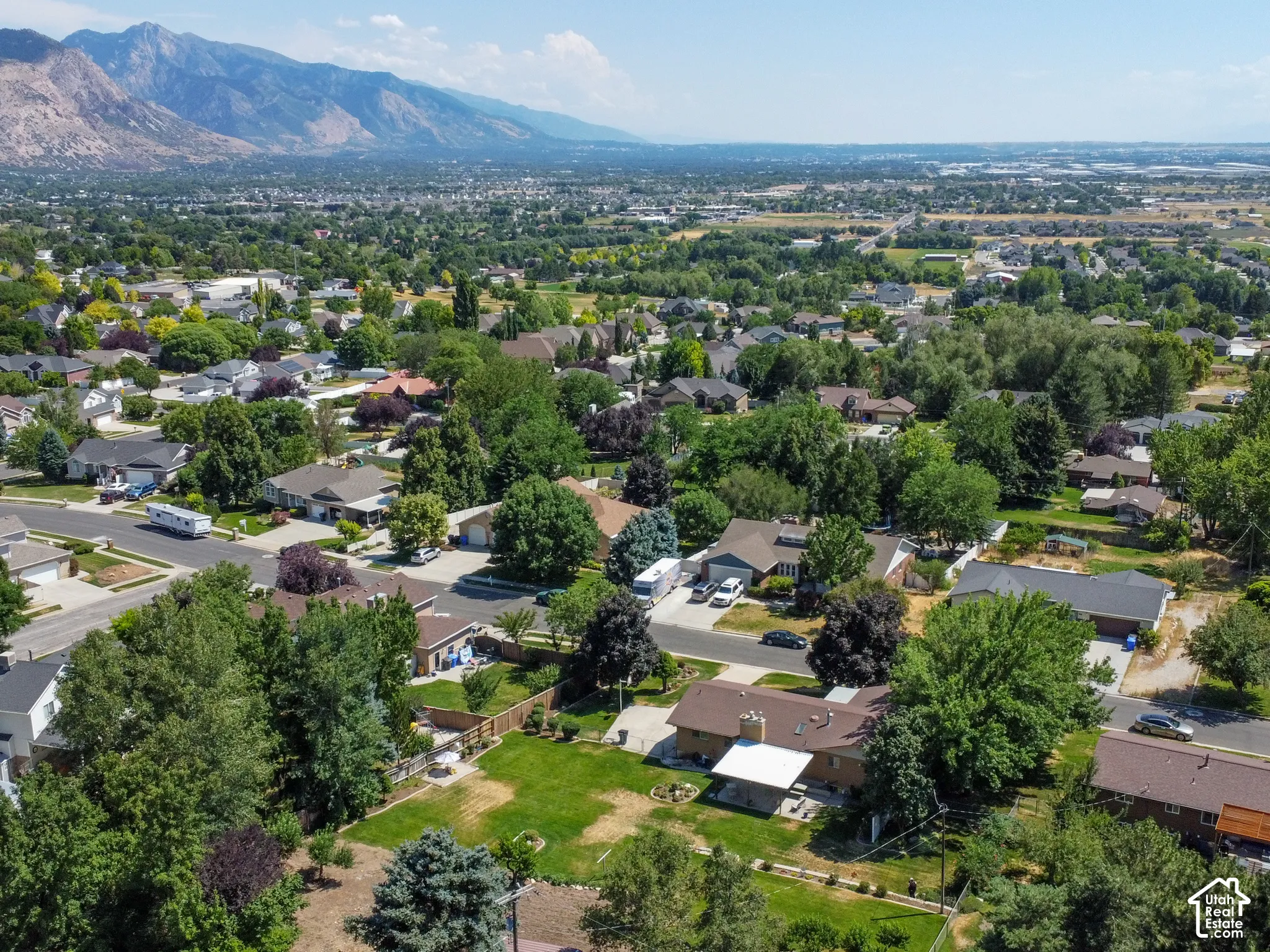 Expansive neighborhood with diverse residential architecture and mature landscaping