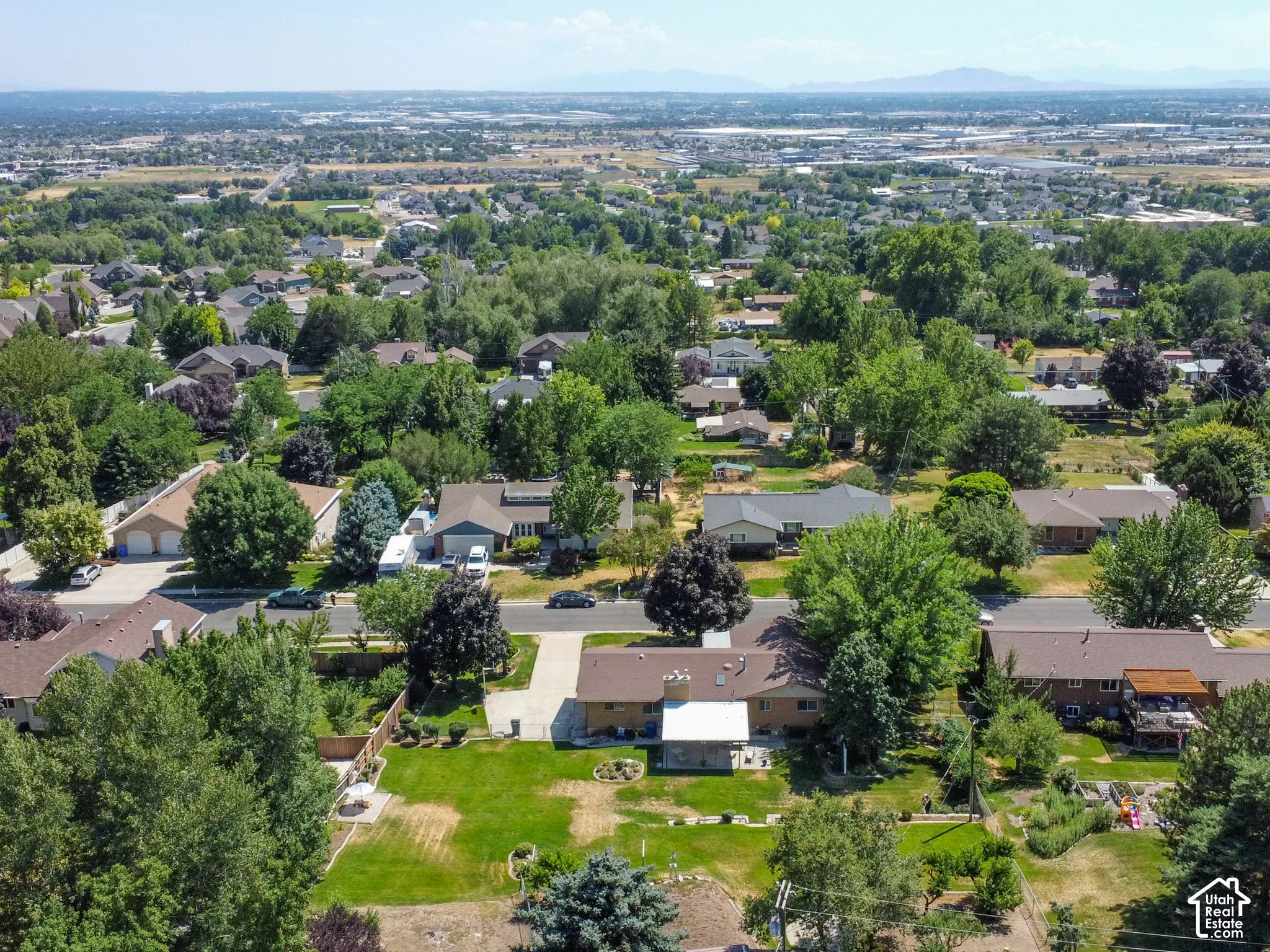 Aerial perspective showcasing a residential neighborhood with established homes and mature landscaping