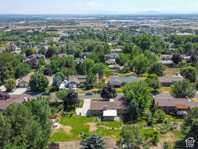 Aerial perspective showcasing a residential neighborhood with established homes and mature landscaping