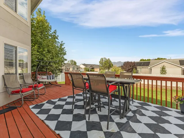 Expansive wood-finish deck with a wood railing system