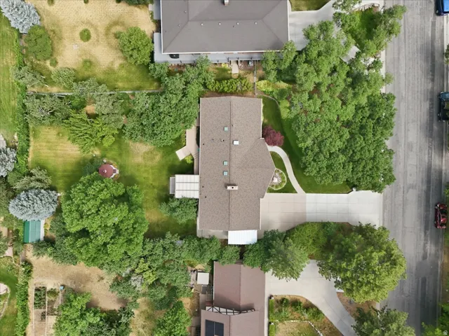 Spacious property featuring expansive lawns and mature trees