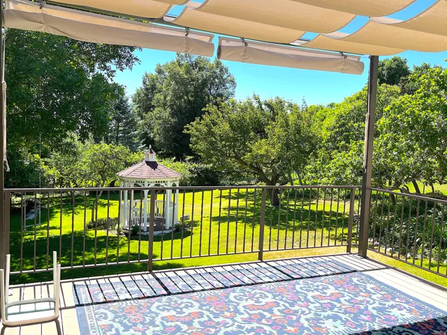 Expansive exterior decking with a retractable canopy
