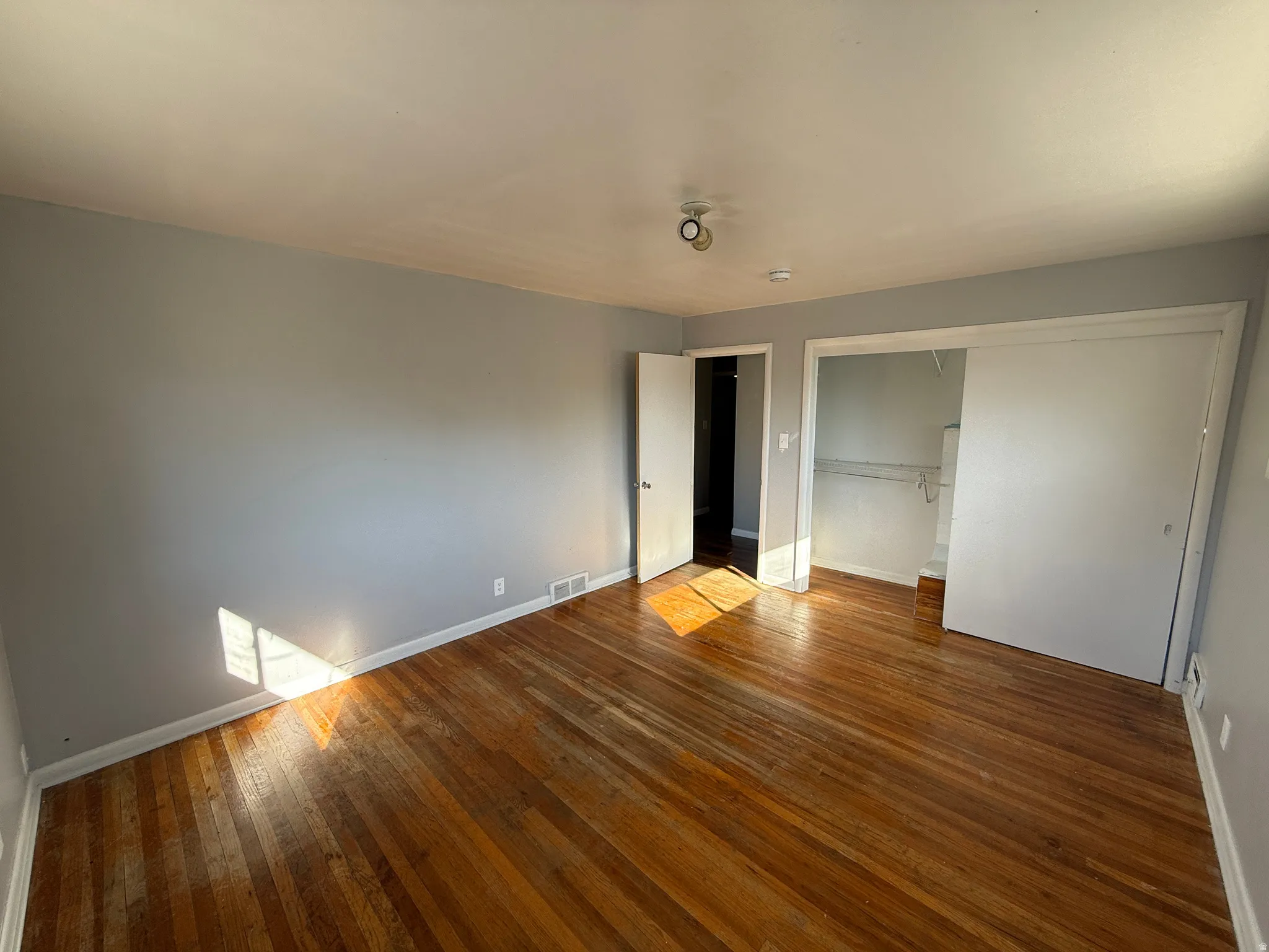 Hardwood flooring extending throughout the room