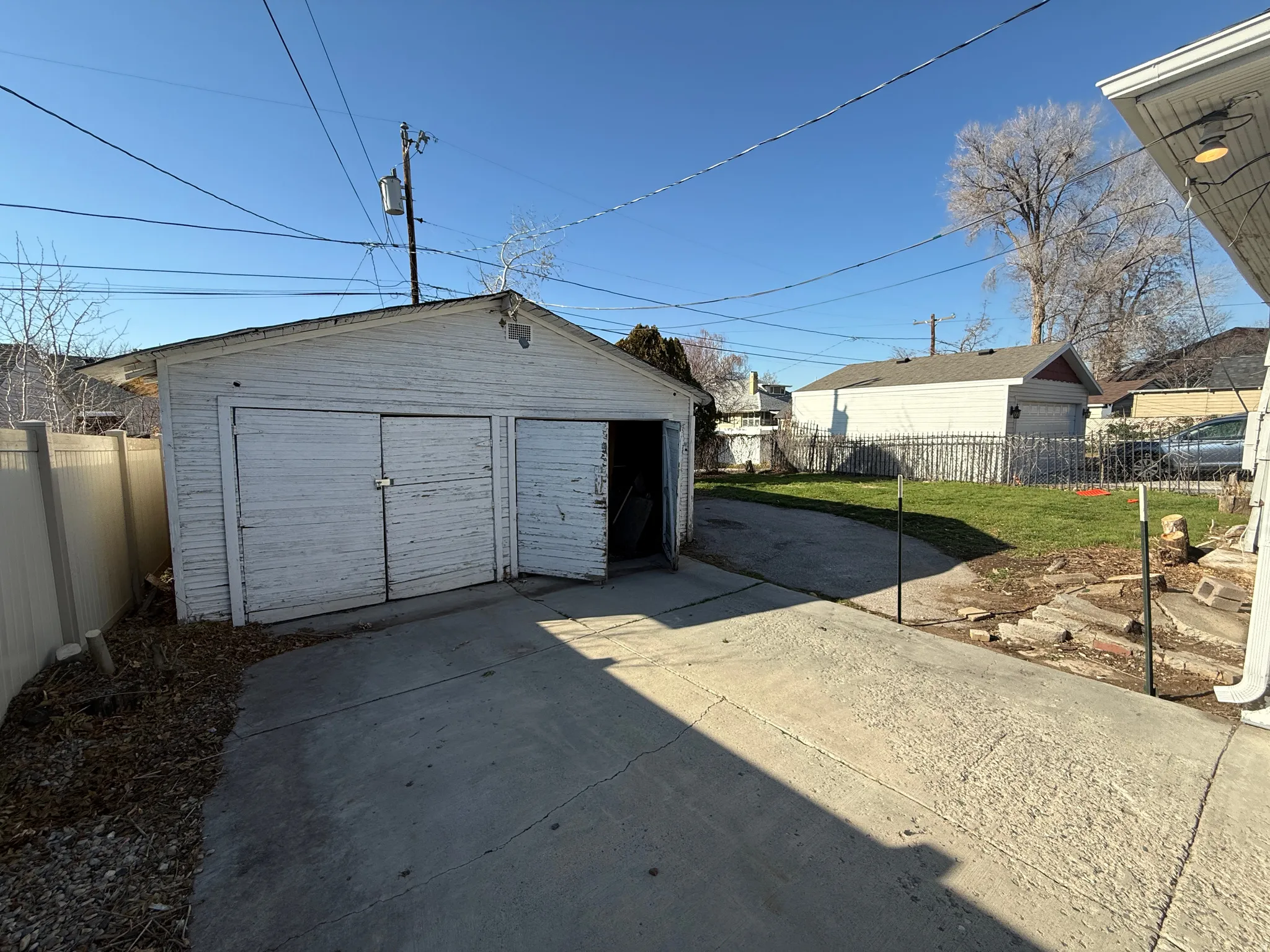 Detached two-car garage with concrete driveway