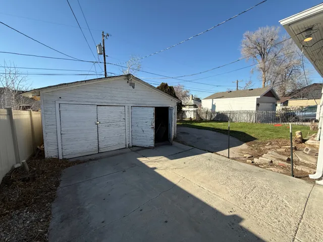 Detached two-car garage with concrete driveway