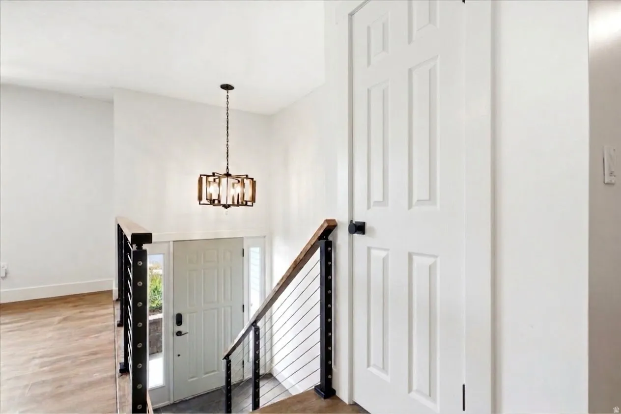 High ceilings featuring a decorative chandelier
