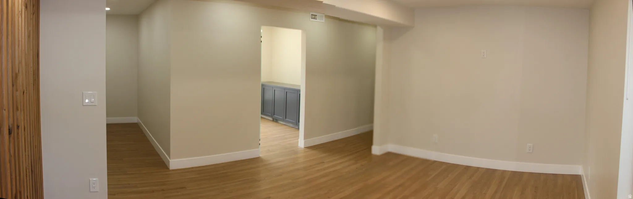 Open-concept room with light neutral wall tones