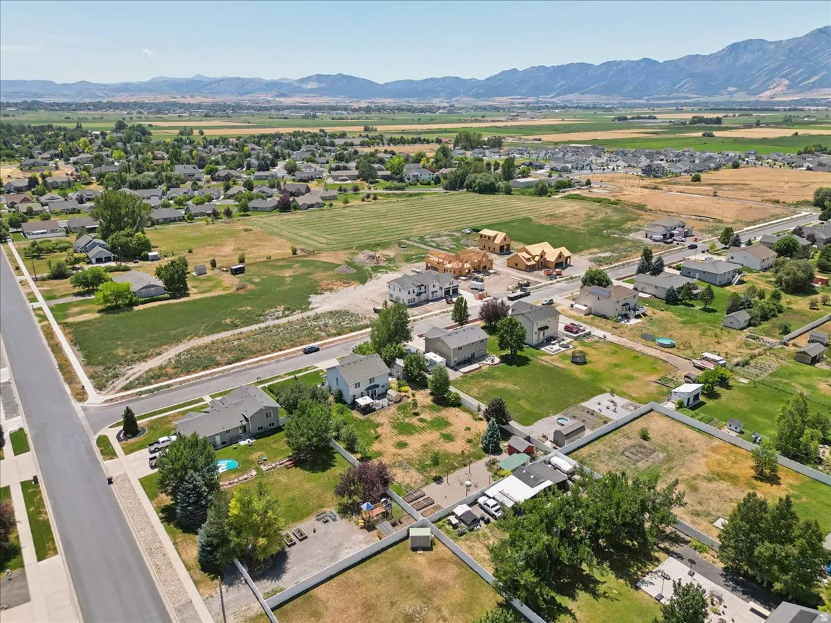 Expansive aerial perspective showcasing a residential development with established homes and new construction
