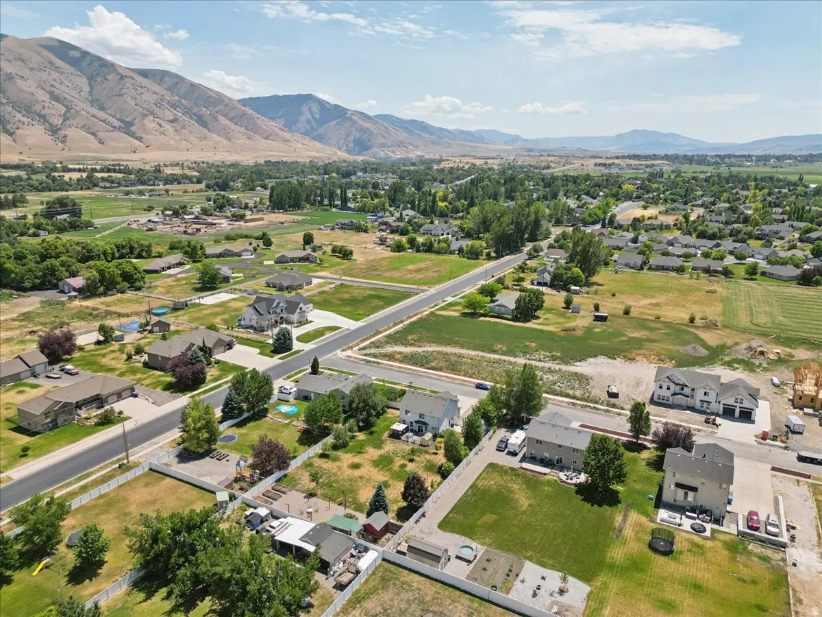 Expansive aerial perspective showcasing a neighborhood with varied residential properties