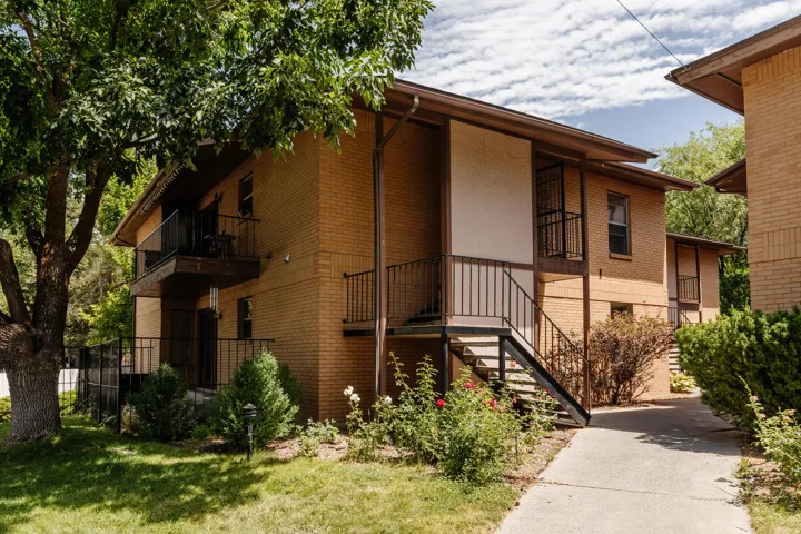 Brick exterior with multiple private balconies and black wrought iron railings