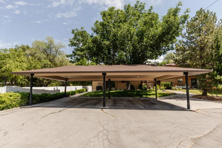 Covered carport structure with multiple bays