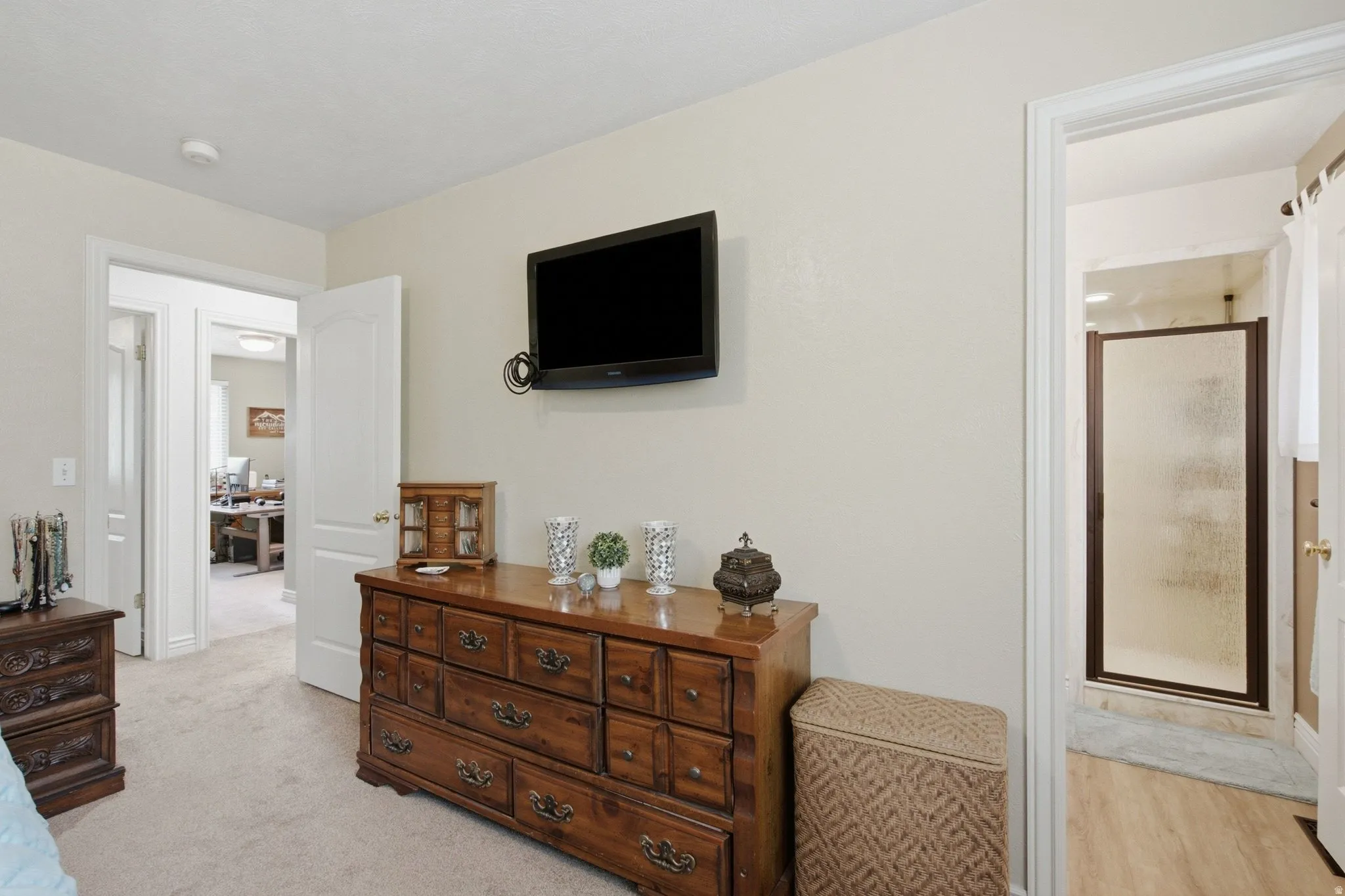 Wall-mounted television with visible wiring