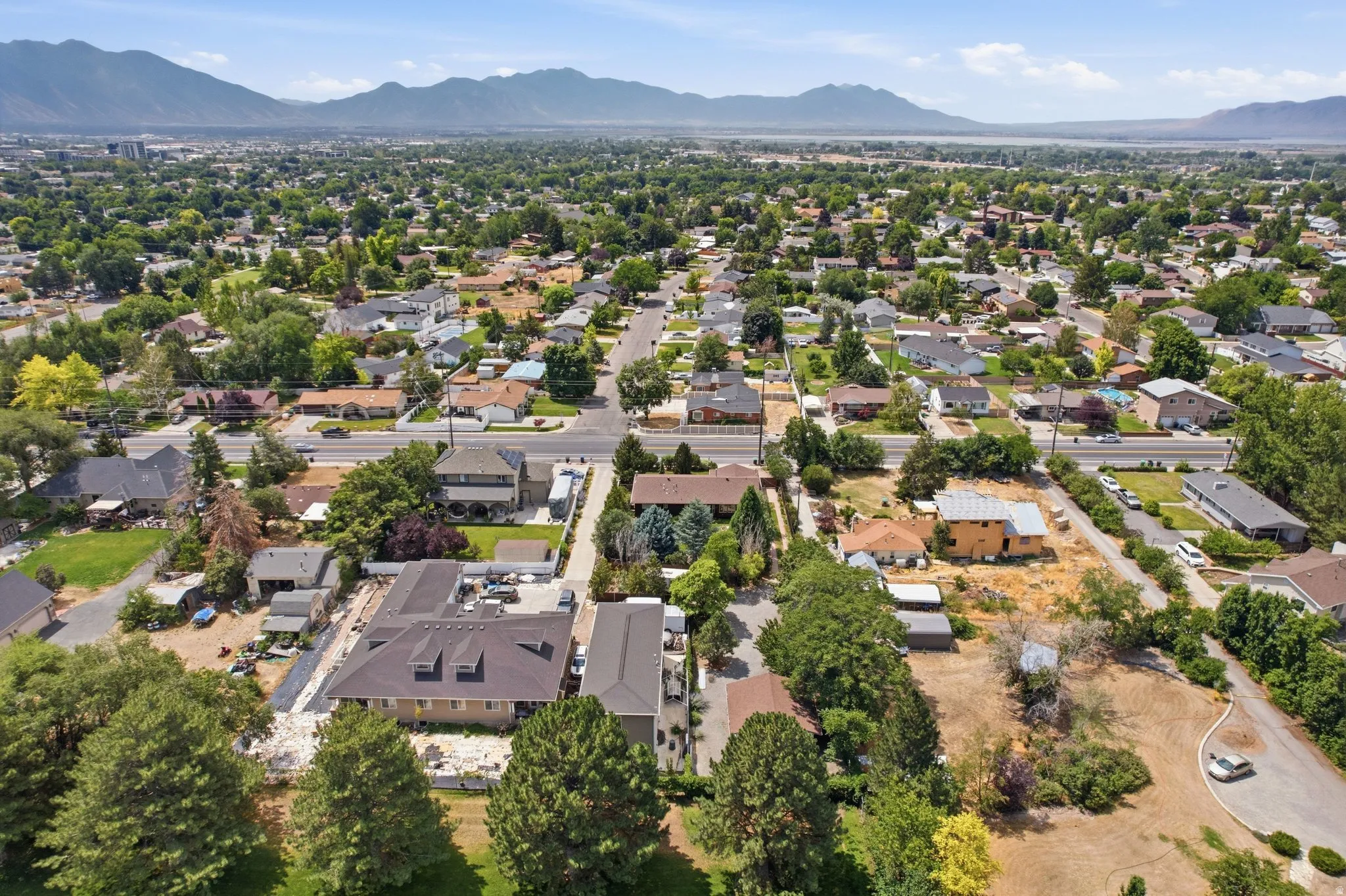 Panoramic aerial view of a residential area with varied housing styles