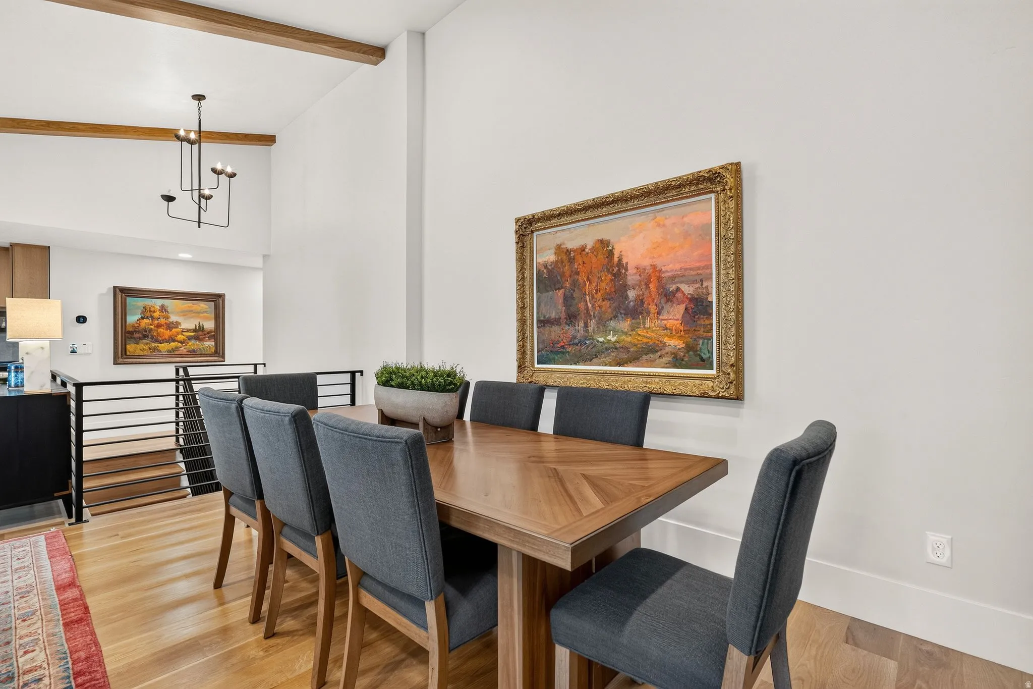 Dining area featuring a wood-finish dining table and light wood-finish flooring
