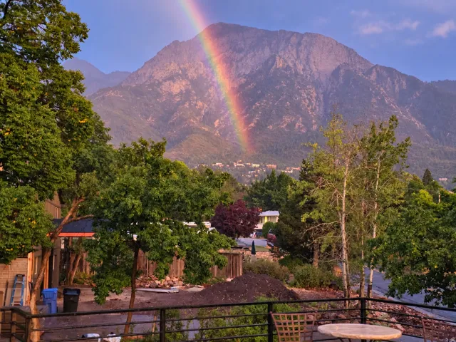 View to Mt Olympus from the elevated deck over the garage with a rainbow on August 13, 2026.