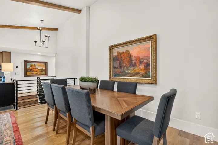 Dining area featuring a wood-finish dining table and light wood-finish flooring