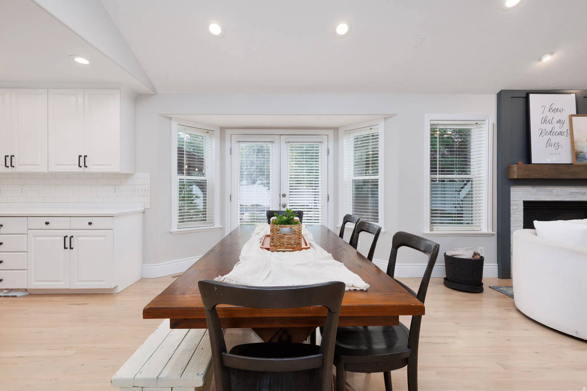Open-concept area featuring light wood-finish flooring