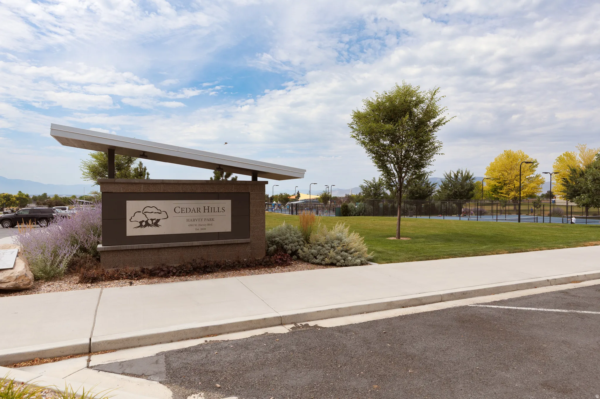 CEDAR HILLS HARVEST PARK signage with integrated sloped metal roof