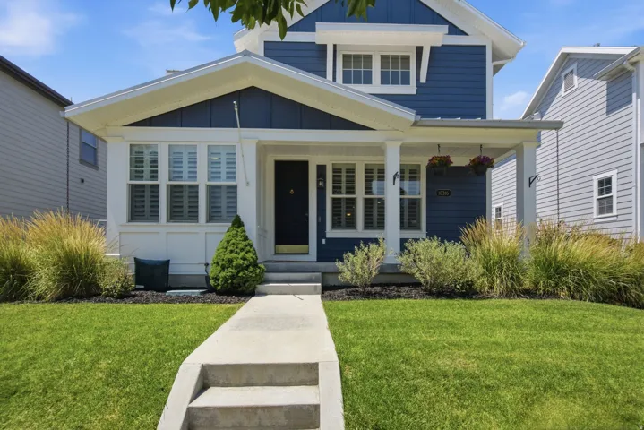 Blue siding exterior with white trim details