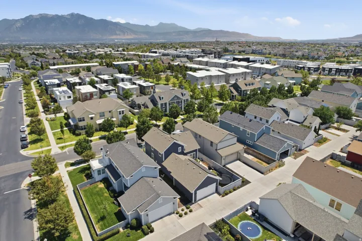 An aerial perspective showcases a residential neighborhood with diverse architectural styles