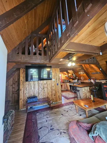 Vaulted ceilings featuring exposed wood beams - Living Room & Dining