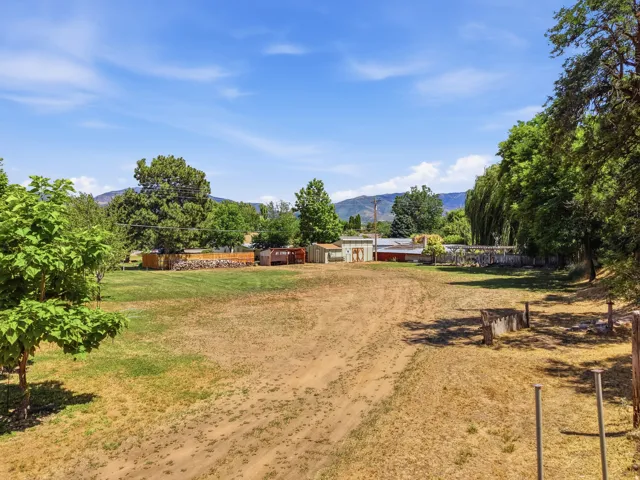 Expansive outdoor space featuring a combination of natural terrain and grassy areas