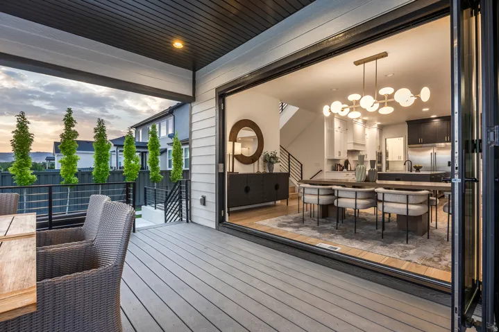 Expansive outdoor patio with a composite deck, offering direct access to the interior via large bi-fold doors