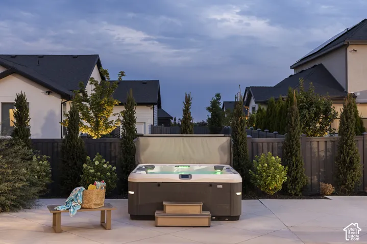 Outdoor spa featuring integrated lighting and exterior steps