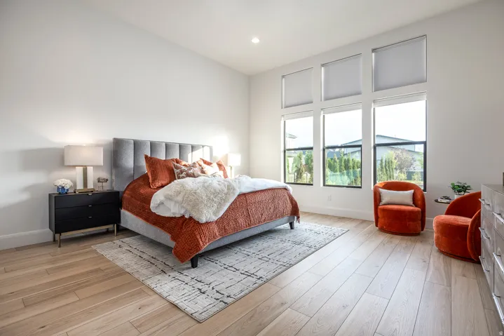 Room featuring tall ceilings and light wood-finish flooring