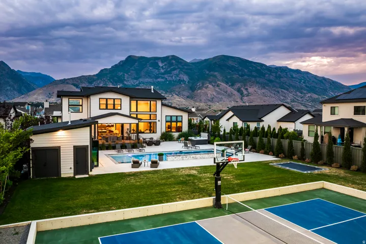 Modern residence featuring extensive rear yard amenities