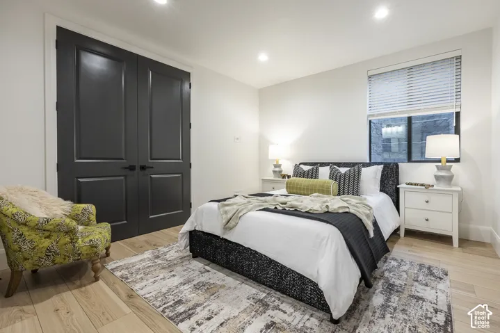 Light wood-finish flooring with white baseboards throughout