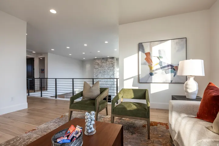 Open concept interior featuring wood-finish flooring and recessed lighting